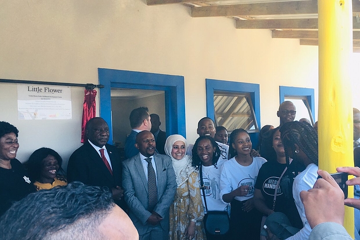 Group of People: Our partner team from the Nelson Mandela Foundation with President Cyril Ramaphosa as he unveils the plaque at the Little Flower Early Childhood Development Centre