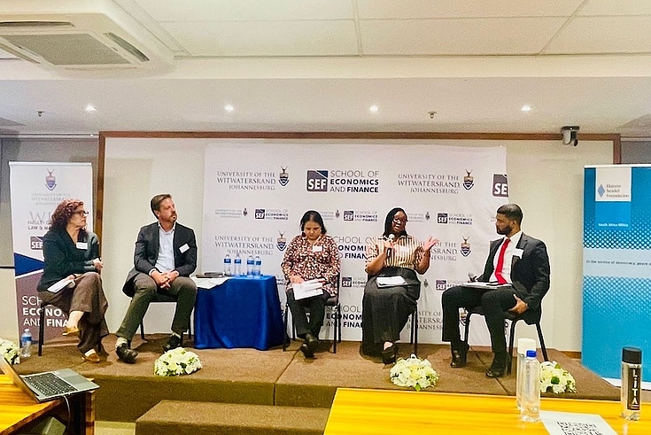 Panel: The panelists with the moderator during the discussion 