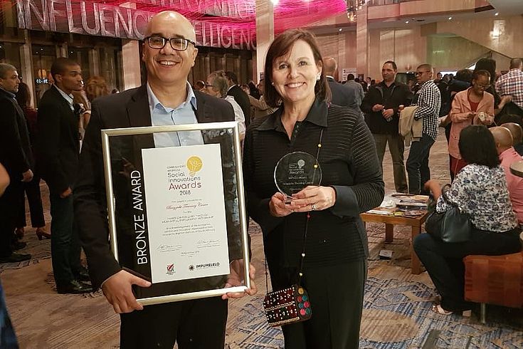Adrian Bezuidenhout, Training Manager, and CEO Renske Minnaar with the award