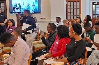 The diverse, large audience in the room and online engaged in a thought-provoking discussion with the panelists